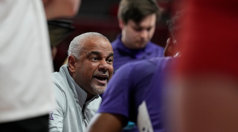 Kansas State head coach Jerome Tang talks to his players during a timeout during the first half of an NCAA college basketball game against Houston, Saturday, Feb. 14, 2026, in Houston. (AP Photo/ Karen Warren)