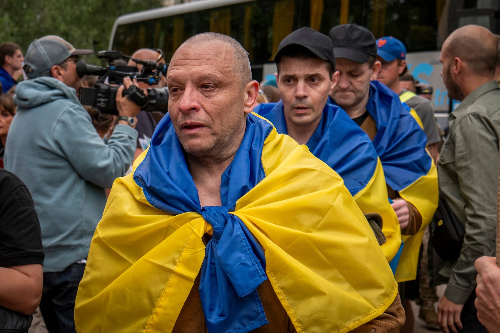 Ukrainian soldier reacts after returning from captivity after a POWs exchange between Russia and Ukraine in Chernyhiv region, Ukraine, Thursday, June 19, 2025. (AP Photo/Dan Bashakov)