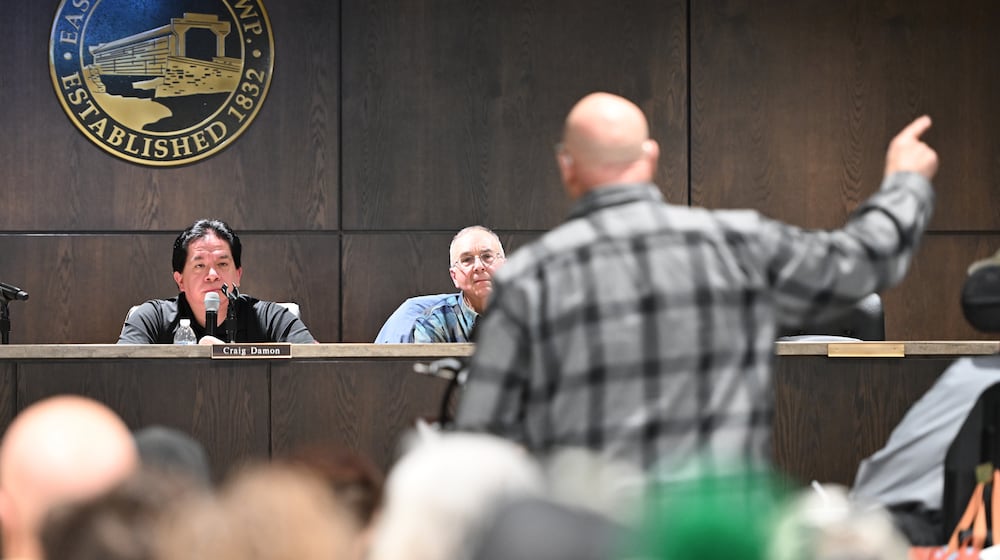 Mike Petak of Spring City gestures while speaking to East Vincent Township supervisors in opposition to a data center proposal at the former Pennhurst state hospital grounds, Dec. 17, 2025, in Spring City, Pa. (AP Photo/Marc Levy)