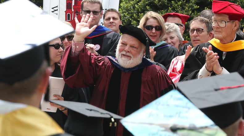 Former Wittenberg University professor and Springfield Mayor Warren Copeland gets a standing ovation as he is awarded the Wittenberg Medal of Honor during a Wittenberg commencement ceremony. Bill Lackey/Staff