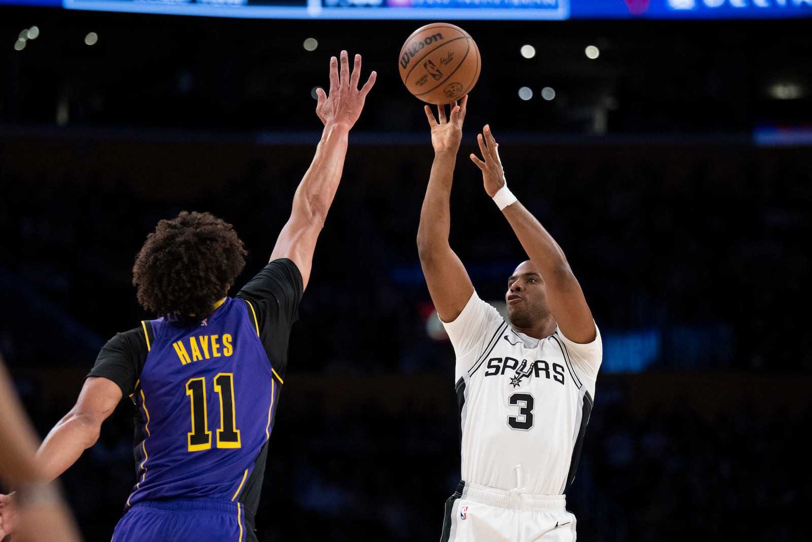 FILE - San Antonio Spurs guard Chris Paul (3) shoots over Los Angeles Lakers center Jaxson Hayes (11) during the first half of an NBA basketball game in Los Angeles, March 17, 2025. (AP Photo/Kyusung Gong, file)