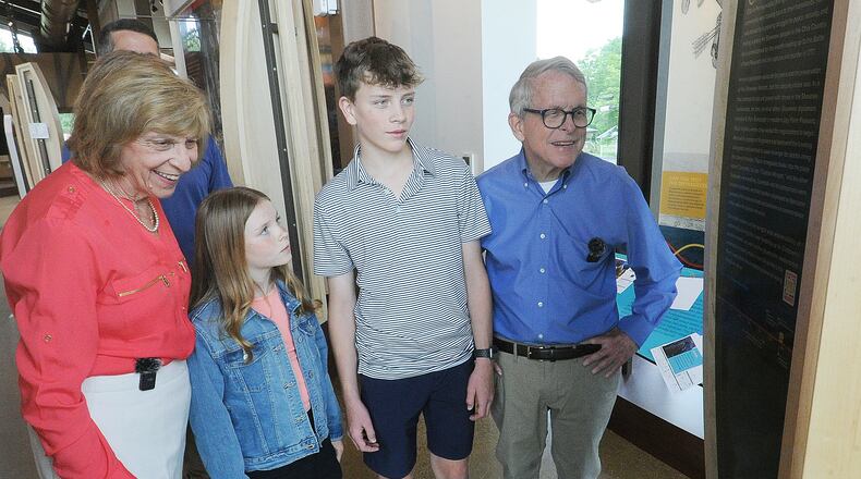 Ohio Governor Mike DeWine and first lady Fran, with grandchildren, Parker and Addie DeWine checkout one of the many historic displays Monday, June 3, 2024. inside the interpretive center at the Great Council State Park near Xenia. MARSHALL GORBY\STAFF