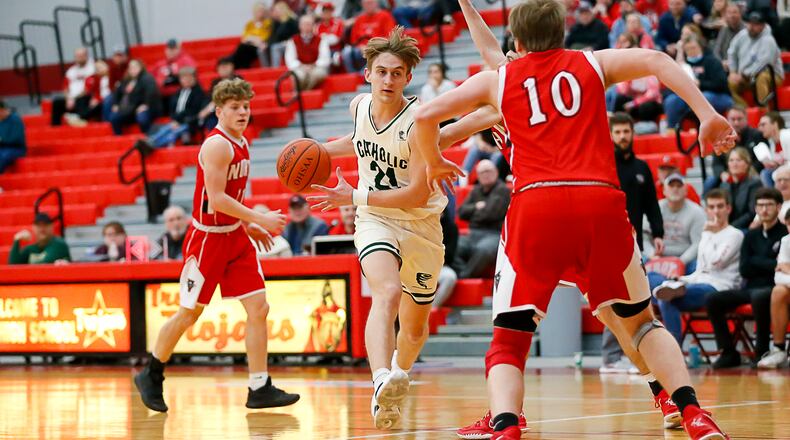 Catholic Central High School junior Tyler Galluch drives through multiple Tri-County North defenders during their game on Wednesday night at Troy High School. CONTRIBUTED PHOTO BY MICHAEL COOPER