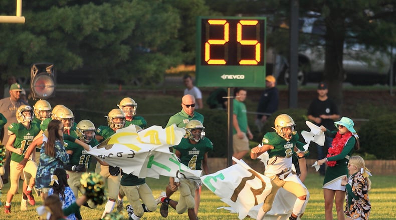 Catholic Central players take the field before a game gainst West Jefferson at Hallinean Field on Friday, Sept. 17, 2021, in Springfield. David Jablonsk/Staff