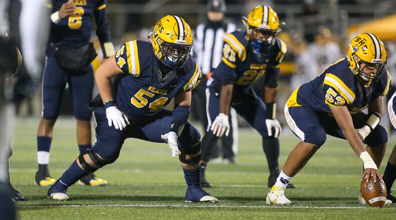 Cutline (works for either photo): Springfield High School offensive guard Kraeton Muenchau waits at the line during their game against Moeller on Friday, Nov. 26 at Sidney Memorial Stadium. Michael Cooper/CONTRIBUTED