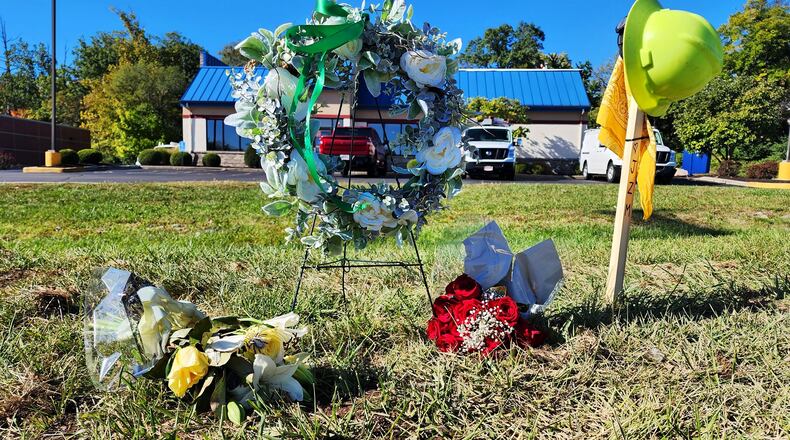 Memorial at the paver accident crash site on Main Street in Hamilton where Jacob Moler was killed and Damion Winkler injured on Oct. 3, 2023. NICK GRAHAM/STAFF