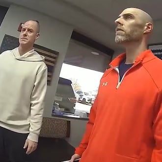 Tipp City Police bodycam footage shows Caleb Flynn in handcuffs asking a detective why he is being charged. TIPP CITY POLICE