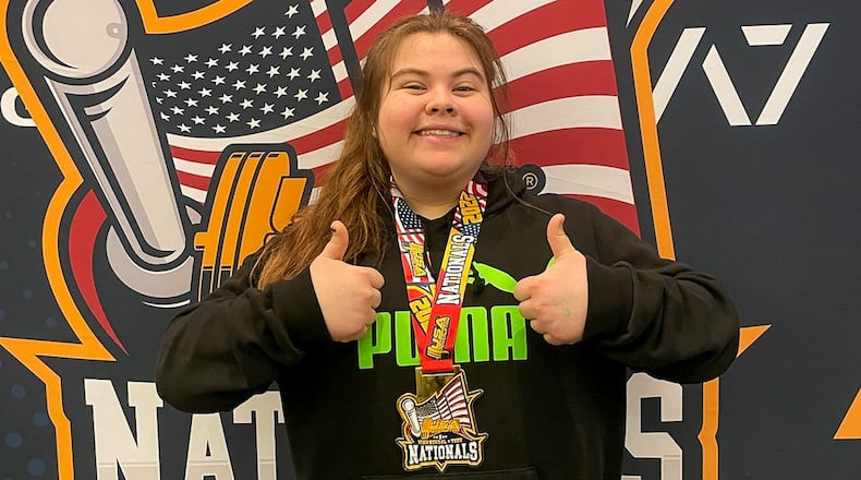 Cutline: Global Impact STEM Academy sophomore Sammi Davis poses with her medal after winning the 100+ kg female division at the USA Powerlifting High School Nationals on March 26 in Lombard, Ill. CONTRIBUTED