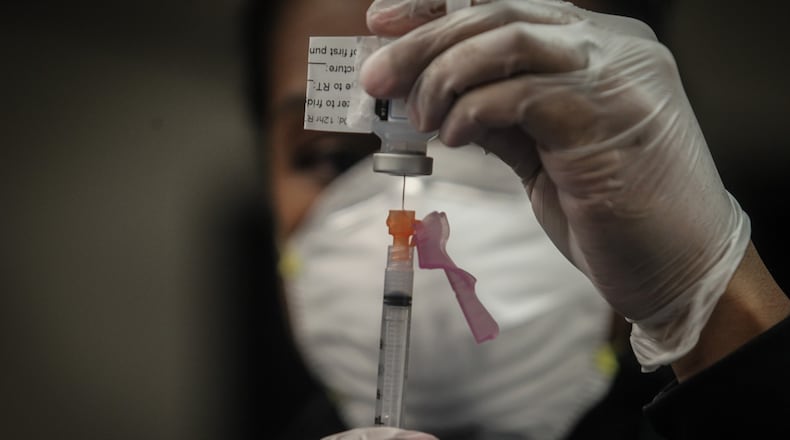 The COVID-19 vaccine arrived in Dayton Dec. 22, 2020 at Miami Valley Hospital. Doctors and nurses were the first to receive the vaccine.JIM NOELKER/STAFF