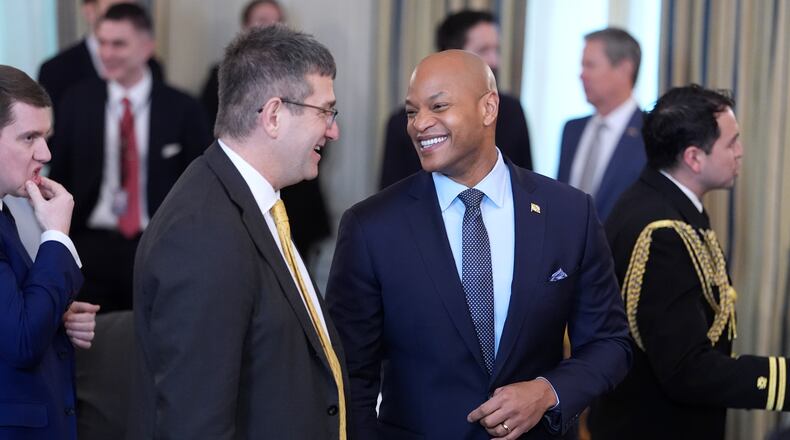 Gov. Wes Moore, D-Md., right, attends a breakfast with the National Governors Association in the State Dining Room of the White House, Friday, Feb. 20, 2026, in Washington. (AP Photo/Evan Vucci)