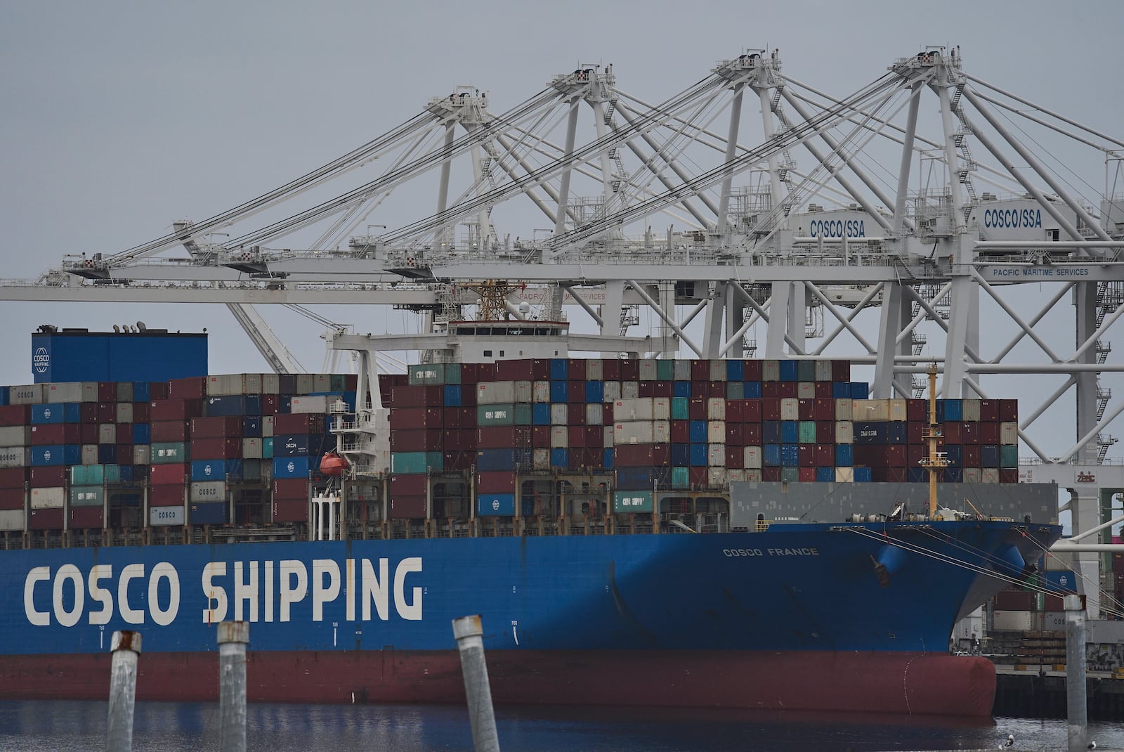 FILE -The "Cosco Shipping France" container ship is moored at the Long Beach Container Terminal, LBCT, at Middle Harbor in the Port of Long Beach, Calif., , April 15, 2025. (AP Photo/Damian Dovarganes, File)