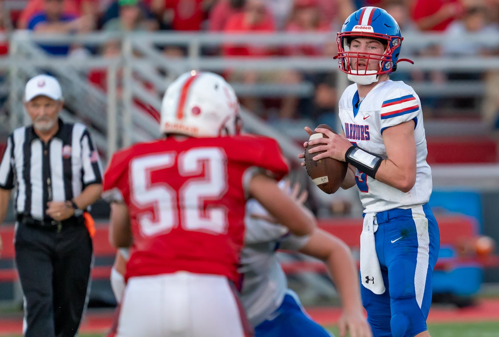 Northwestern High School senior Ried Smith drops back to pass during their game at Southeastern Friday, Aug. 22 at Trojan Stadium in South Charleston. The Warriors won 50-7. RODNEY GETZ / CONTRIBUTED PHOTO