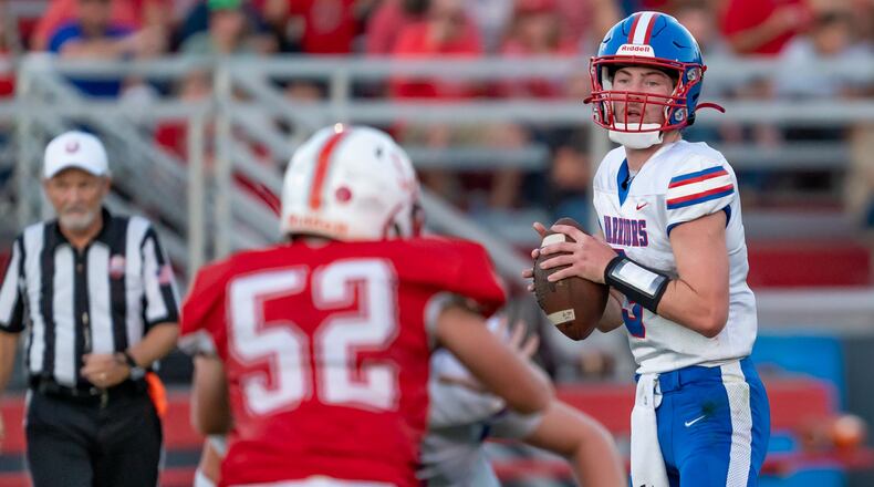 Northwestern High School senior Ried Smith drops back to pass during their game at Southeastern Friday, Aug. 22 at Trojan Stadium in South Charleston. The Warriors won 50-7. RODNEY GETZ / CONTRIBUTED PHOTO
