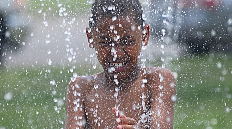 FILE PHOTO: Ma’Liek Allen, 8, takes advantage of the waterpark along Riverview Ave. on a very hot Monday afternoon. STAFF/MARSHALL GORBY