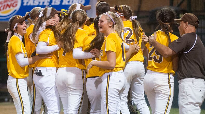 OHIO PRESS PHOTO SYSTEM SPECIAL TO THE DAYTON DAILY NEWS-The Kenton Ridge team celebrates the final out of the seventh inning of the Ohio High School Div. II softball semi-final, against Granville, in Akron, Friday, June 7, 2013. Kenton Ridge won 1-0. (PHIL LONG/OHIO PRESS PHOTO SYSTEM)