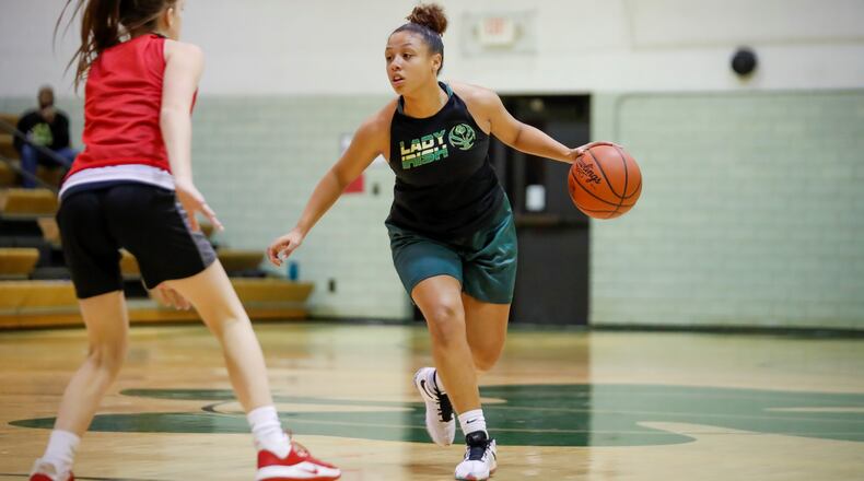 Catholic Central High School senior Abbigail Peterson dribbles the ball during a scrimmage game against Houston on Monday, Nov. 16 at Jason Collier Gymnasium in Springfield. Michael Cooper/CONTRIBUTED