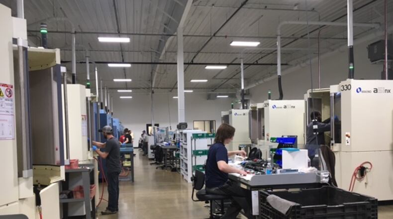 Employees at Norwood Medical in Dayton kept rows of CNC (computer numeric controlled) machines busy on a recent afternoon. THOMAS GNAU/STAFF