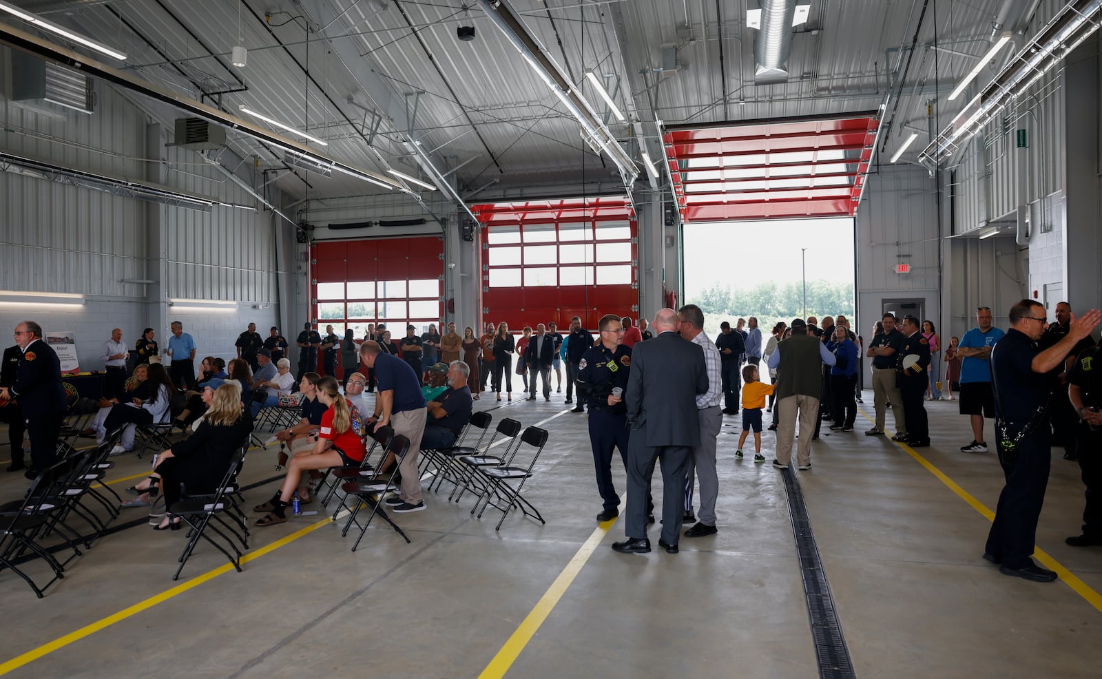 A group gathers to celebrate the opening of Springfield Fire Station 6 on Tuesday, June 17, 2025, on South Charleston Pike. JOSEPH COOKE/STAFF
