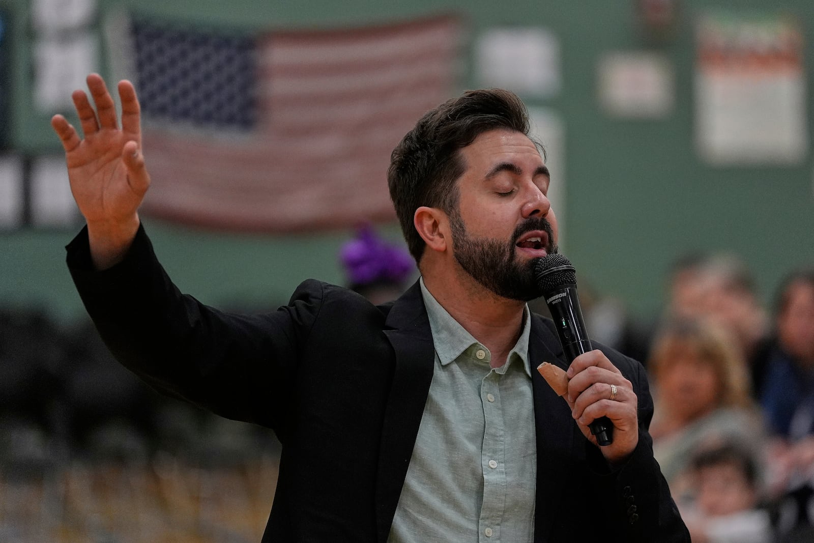 River Church Cincinnati pastor Cory Bowman, who is Vice President JD Vance's half brother and Cincinnati mayoral candidate, preaches during Easter worship service in the Hays Porter Elementary School gym Sunday, April 20, 2025, in Cincinnati. (AP Photo/Carolyn Kaster)