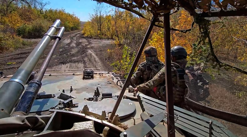 In this image made from video provided by the Russian Defense Ministry Press Service on Friday, Oct. 31, 2025, Russian servicemen attend a practice for sabotage operations behind enemy lines at a training ground on an undisclosed location. (Russian Defense Ministry Press Service via AP)