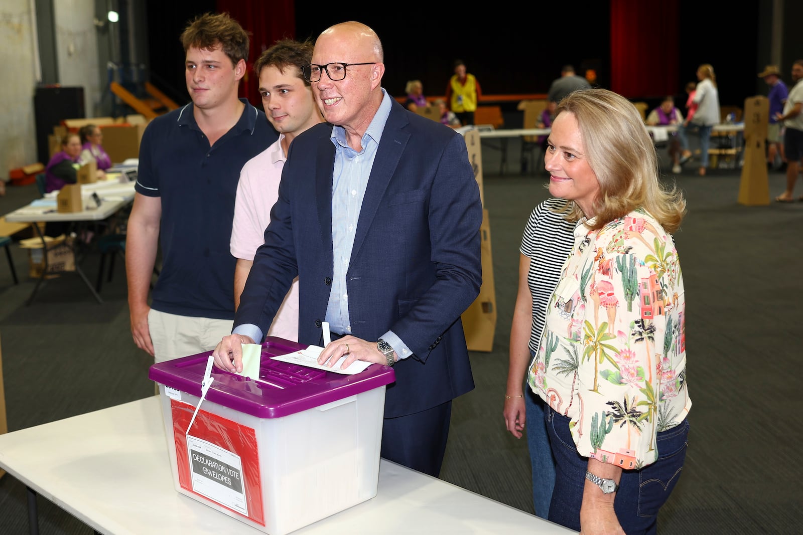 Australian Liberal Party leader Peter Dutton stands with his sons, Tom and Harry and his wife Kirilly as he votes in his electorate in Brisbane, Australia, Saturday, May 3, 2025. (AP Photo/Pat Hoelscher)
