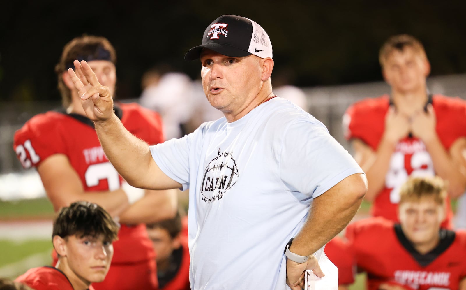 Tippecanoe coach Matt Burgbacher talks to playerrs after a 62-0 win over Sidney on Thursday, Sept. 25 at Tipp City Park. BRYANT BILLING / STAFF