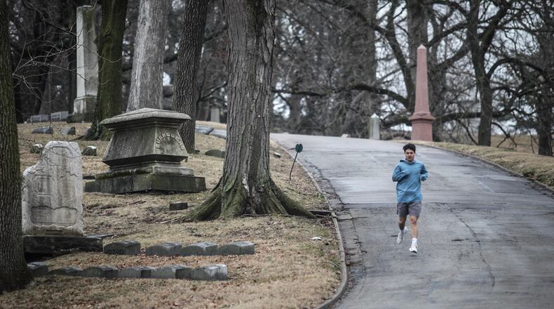 Jogging is still an OK thing to do while social distancing. JIM NOELKER/STAFF
