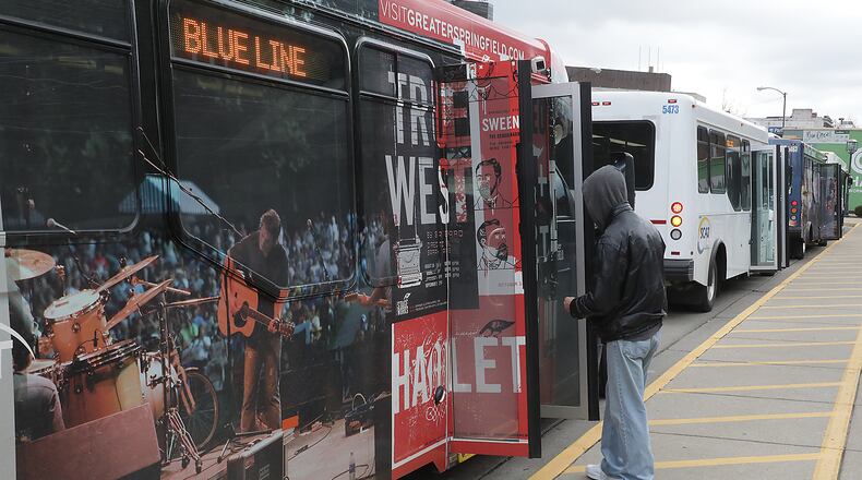 A man gets on a SCAT bus at the bus center in downtown Springfield. BILL LACKEY/STAFF