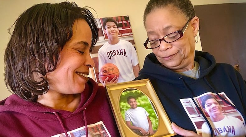 Auicia Andrews, left, and Rhonda Rogan, right, say the past year without Troy Byrd has been difficult for their family. They are now encouraging other families to get CT scans on their children’s hearts. JENNA LAWSON/STAFF.