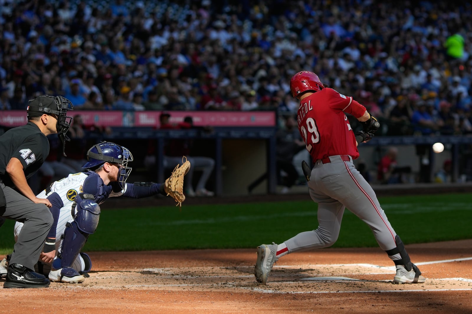 Cincinnati Reds' TJ Friedl hits a home run during the third inning of a baseball game against the Milwaukee Brewers Sunday, Sept. 28, 2025, in Milwaukee. (AP Photo/Morry Gash)