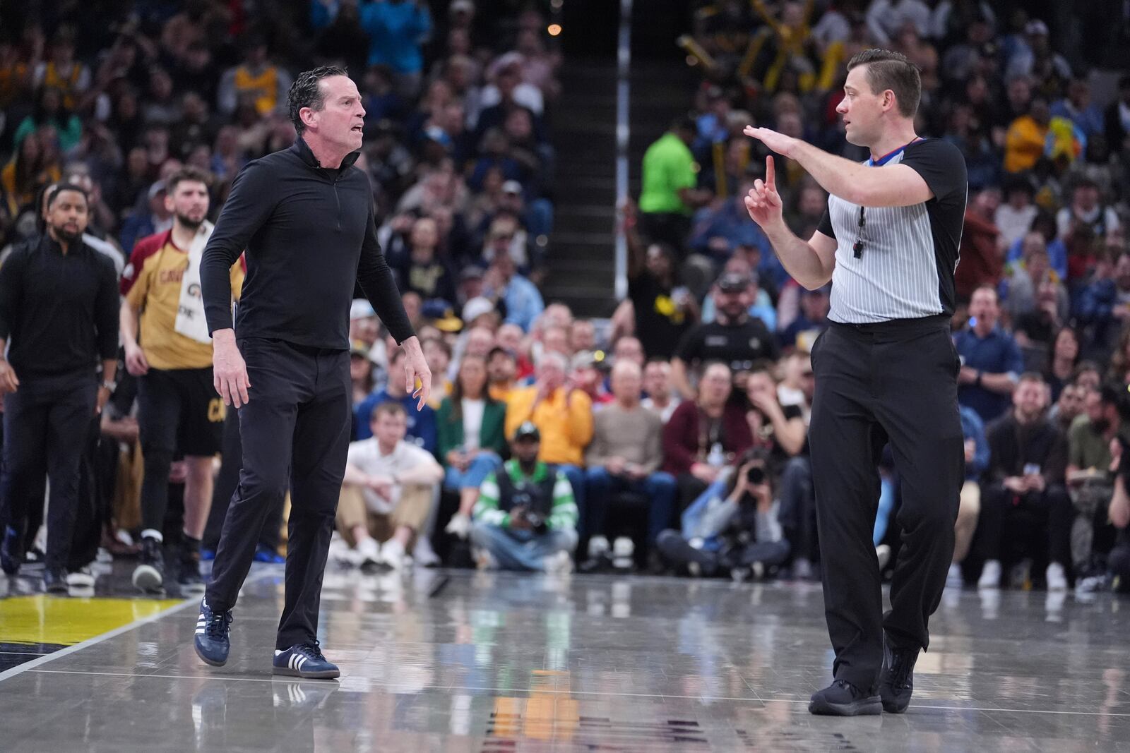Cleveland Cavaliers head coach Kenny Atkinson receives a technical during the second half of an NBA basketball game against the Indiana Pacers in Indianapolis, Thursday, April 10, 2025. (AP Photo/Michael Conroy)