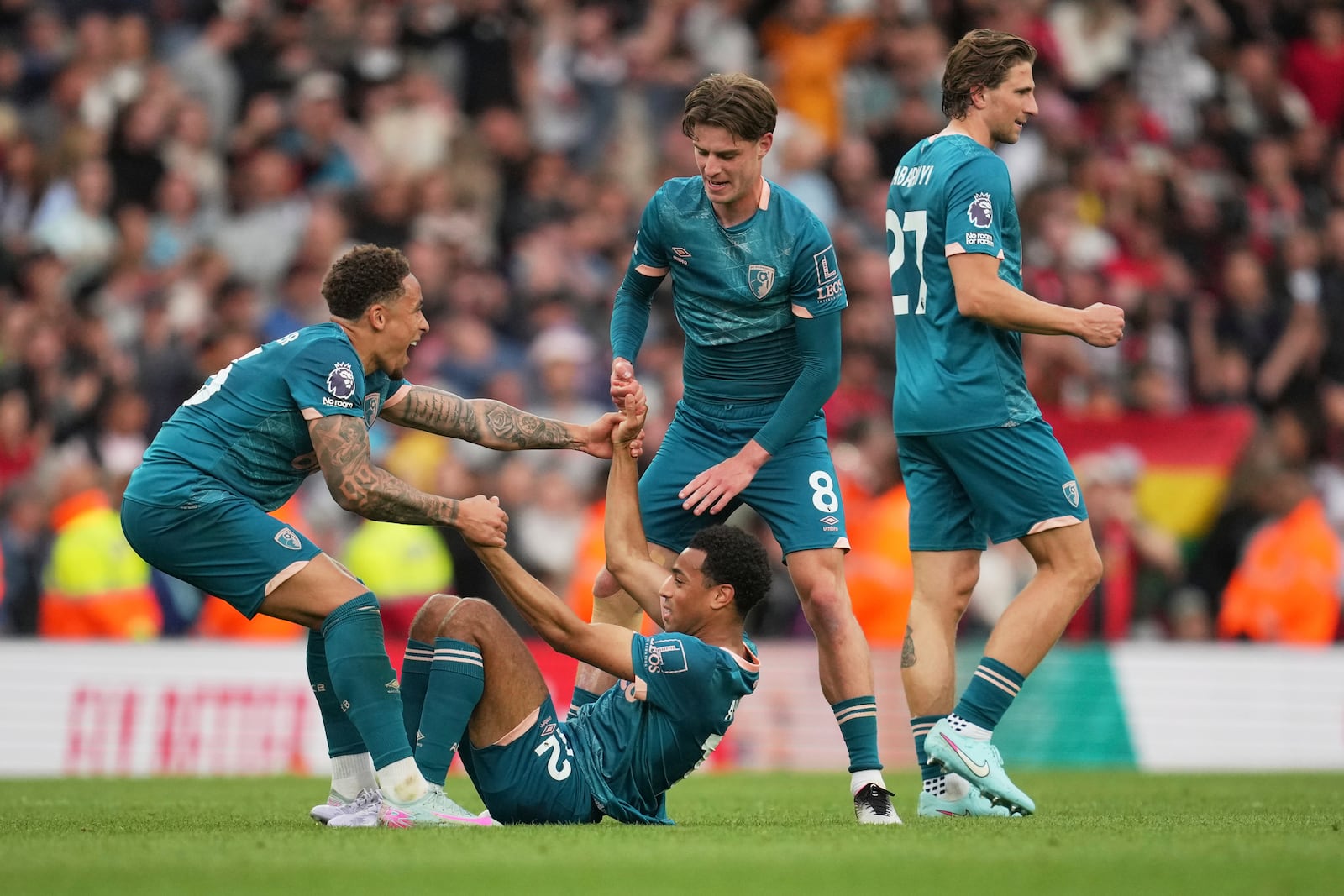 Bournemouth players celebrate at the end of the English Premier League soccer match between Arsenal and Bournemouth at Emirates stadium in London, Saturday, May 3, 2025. (AP Photo/Kin Cheung)