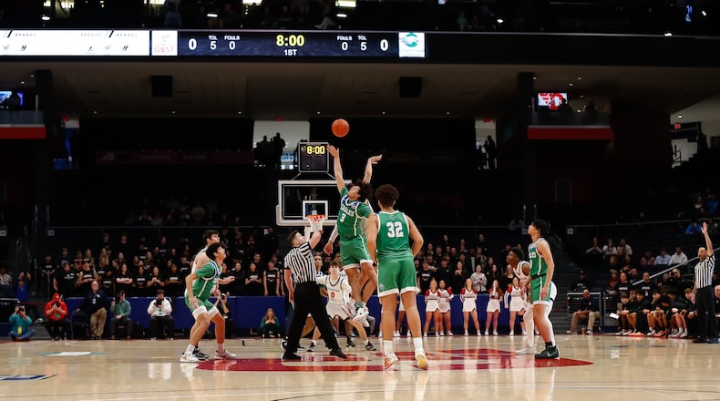 The Chaminade Julienne boys basketball team tips off against Rocky River Lutheran West in a Division II state semifinal at UD Arena on Friday, March 17, 2023. CONTRIBUTED BY MICHAEL COOPER