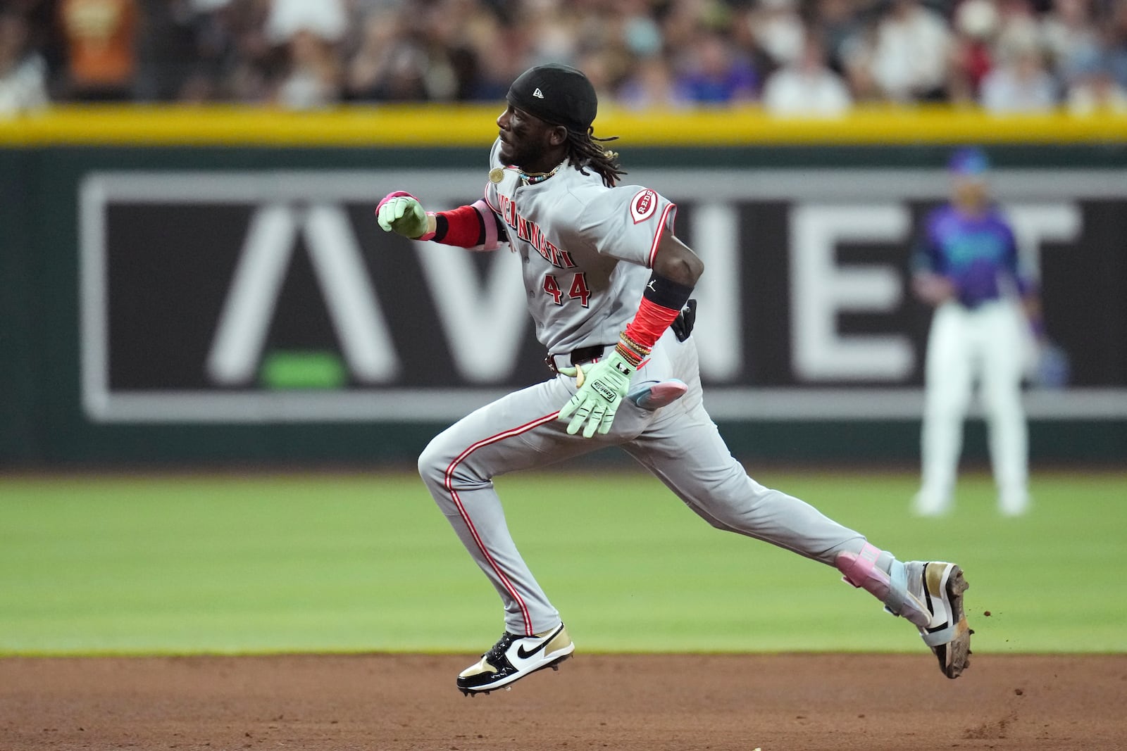 Cincinnati Reds' Elly De La Cruz runs to third base for a triple against the Arizona Diamondbacks during the sixth inning of a baseball game Friday, Aug. 22, 2025, in Phoenix. (AP Photo/Ross D. Franklin)