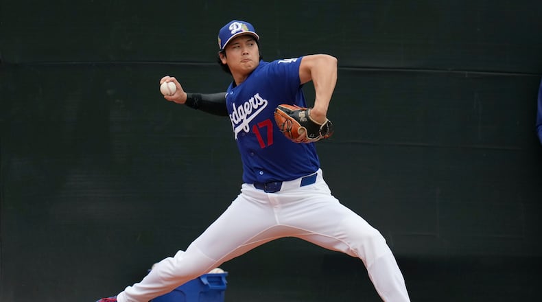 Los Angeles Dodgers pitcher Shohei Ohtani, of Japan, works out during spring training baseball Friday, Feb. 13, 2026, in Phoenix. (AP Photo/Ross D. Franklin)