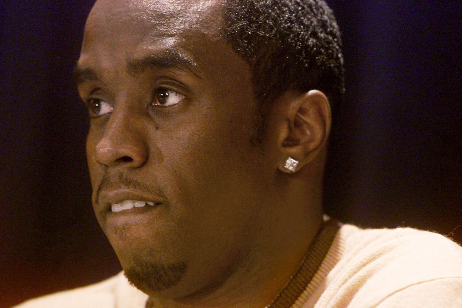 FILE - Rapper-producer Sean "Puffy" Combs answers questions at a news conference on Dec. 28, 1999, in New York, a day after he was arrested and charged with weapons possession after police allegedly found a stolen pistol in his car as he and actress-singer Jennifer Lopez left a nightclub where three people were shot and wounded. (AP Photo/Suzanne Plunkett, File)