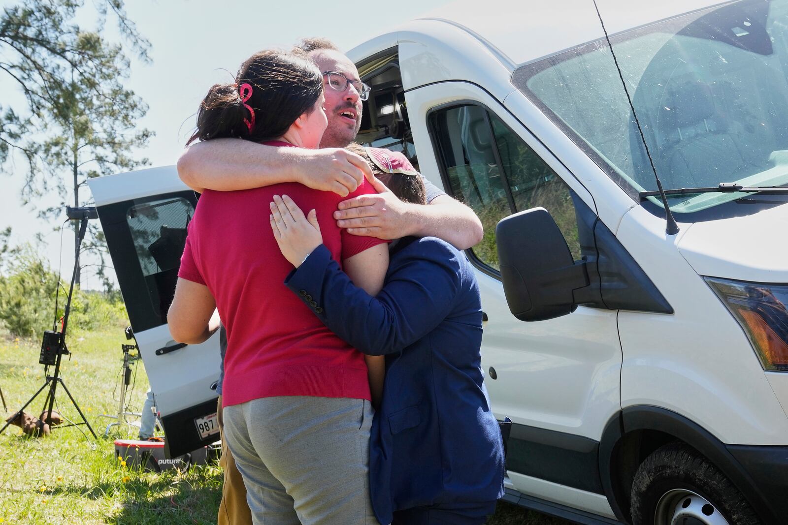 Supporters hug outside the Central Louisiana Ice Processing Center in Jena, La., after an immigration hearing for Mahmoud Khalil, the Columbia University activist facing deportation for his role in pro-Palestinian campus protests, Friday, April 11, 2025. (AP Photo/Gerald Herbert)
