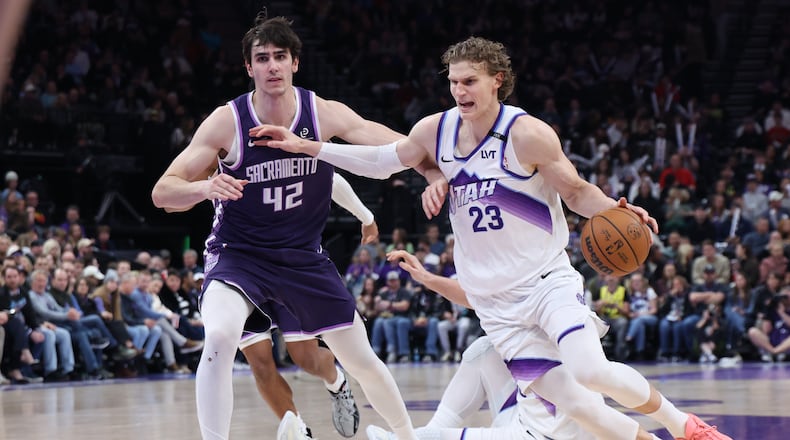 Utah Jazz forward Lauri Markkanen (23) drives to the basket against Sacramento Kings center Maxime Raynaud (42) during the second half of an NBA basketball game, Wednesday, Feb. 11, 2026, in Salt Lake City. (AP Photo/Rob Gray)