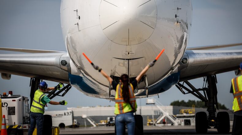 Amazon ground crews position a 767 cargo plan for offload at the Wilmington Air Park. JIM NOELKER/STAFF