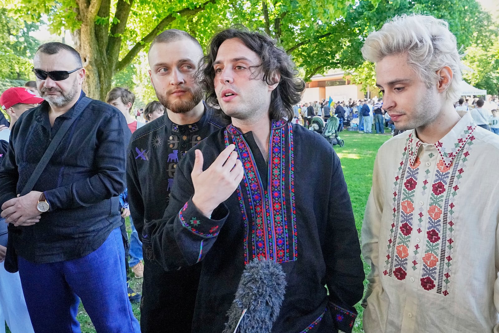 Eurovision competitor band Ziferblat from Ukraine gives an interview to the Associated Press during a family meeting of Ukrainian people in a park in Basel as part of the 69th Eurovision Song Contest week, in Basel, Switzerland, Thursday, May 15, 2025. (AP Photo/Martin Meissner)