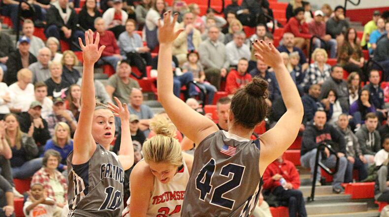 Tecumseh’s Presley Griffitts (with ball) is trapped by Fairmont defenders Olivia Frank (left) and Emma Martcheva in the Division I sectional final at Troy High School last season. GREG BILLING / CONTRIBUTED