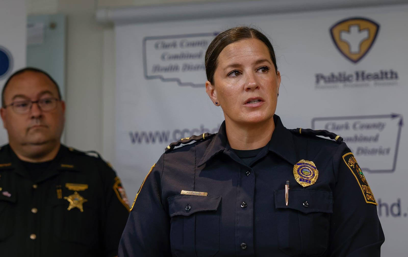 Springfield Police Chief Allison Elliott, right, speaks during a press conference held by the Clark County Combined Health District to honor the annual campaign to discourage impaired driving on Friday, Aug. 22, 2025, at the Clark County Combined Health District Main Conference Room. JOSEPH COOKE/STAFF