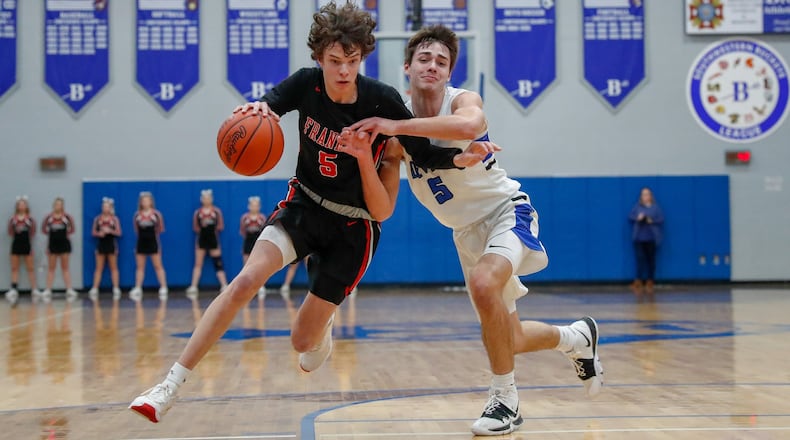Franklin’s Noah Rich is guarded by Brookville’s Daniel Dominique during their game on Friday night in Brookville. The Wildcats won 56-47 to claim at least a share of the Southwestern Buckeye League Southwestern Division title. CONTRIBUTED PHOTO BY MICHAEL COOPER
