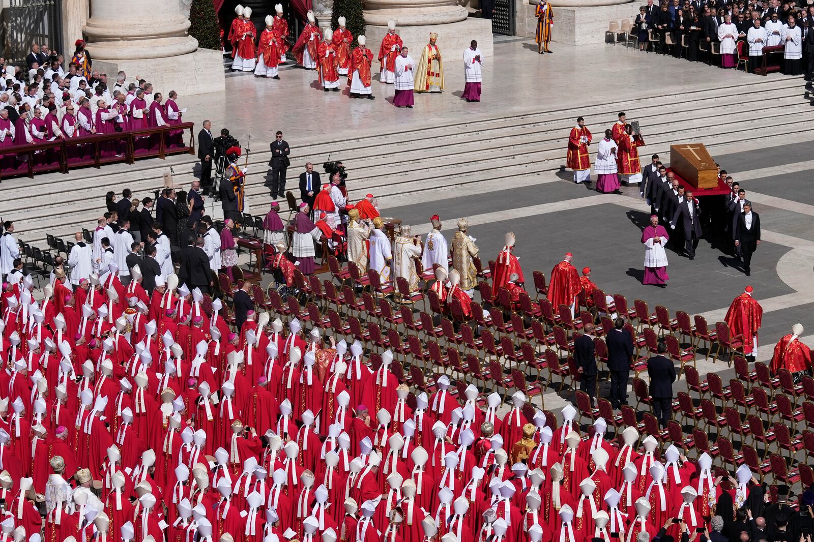 The coffin of Pope Francis is carried into St Peter's Square for his funeral, at the Vatican, Saturday, April 26, 2025. (AP Photo/Gregorio Borgia)