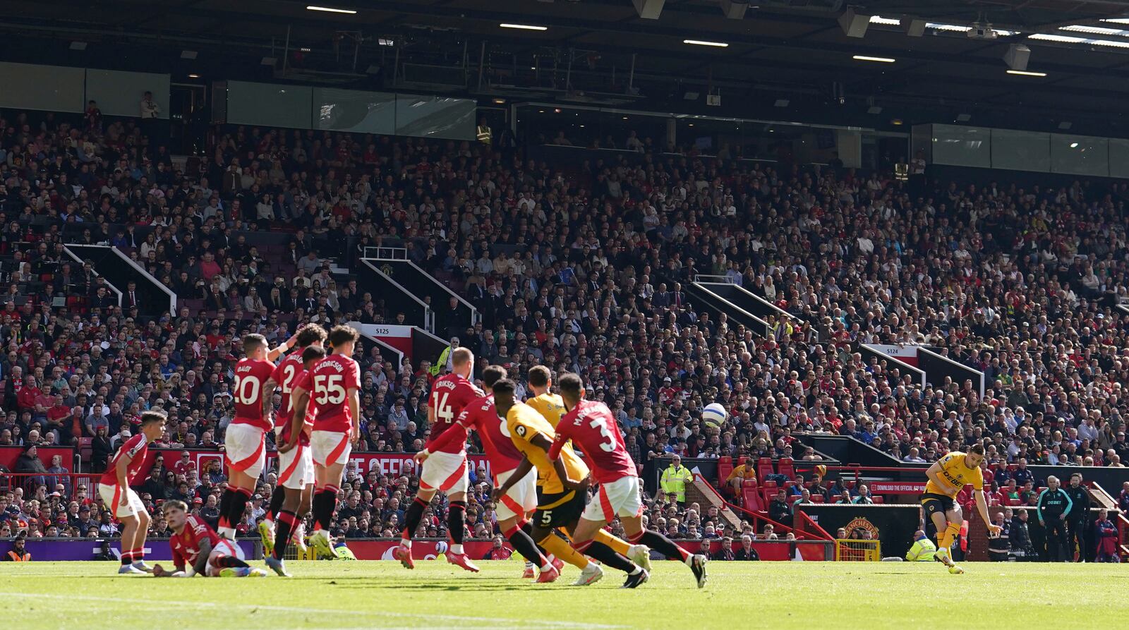 Wolverhampton Wanderers' Pablo Sarabia, second from right, scores his side's first goal of the game, during the English Premier League soccer match between Manchester United and Wolverhampton Wanderers, at Old Trafford, Manchester, England, Sunday, April 20, 2025. (Martin Rickett/PA via AP)