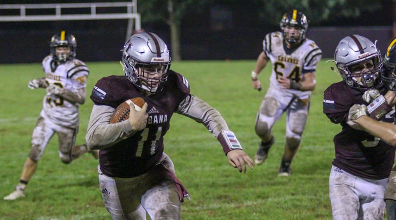 Urbana quarterback Preston Shields runs the ball during the Hillclimbers game against Urbana on Friday night. The Hillclimbers snapped a four-game losing streak, beating the Braves 47-12. Michael Cooper/CONTRIBUTED