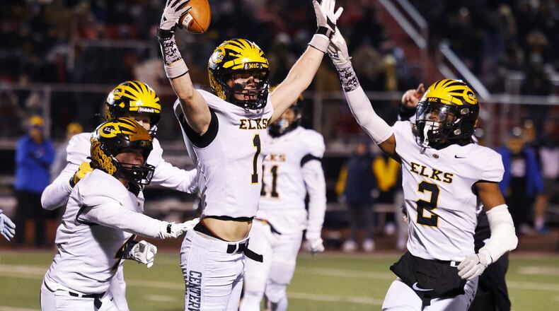 Centerville's Jacob Taylor celebrates and interception during their Division I state semifinal football game against Moeller Friday, Nov. 29, 2024 at Princeton High School in Sharonville. NICK GRAHAM/STAFF