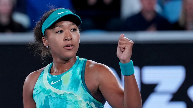Naomi Osaka of Japan reacts after defeating Sorana Cirstea of Romania in their second round match at the Australian Open tennis championship in Melbourne, Australia, Thursday, Jan. 22, 2026. (AP Photo/Dita Alangkara)
