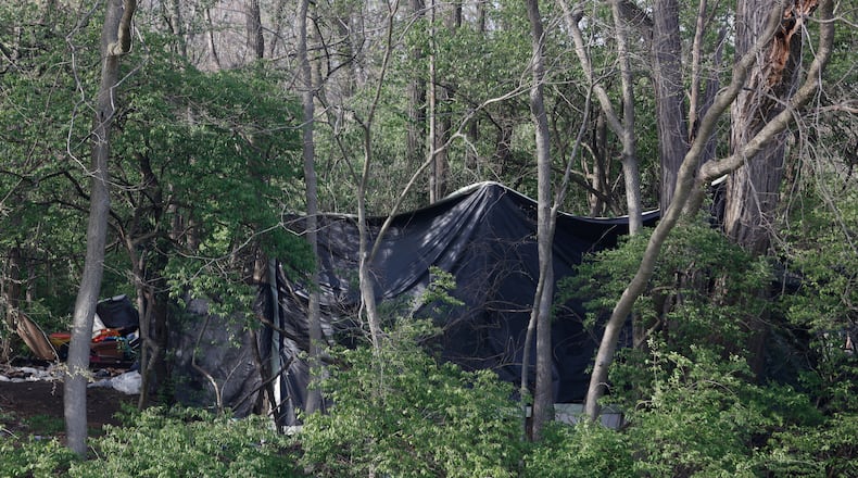 A homeless encampment in the woods on Tuesday, April 22, 2025, at Snyder Park. JOSEPH COOKE/STAFF