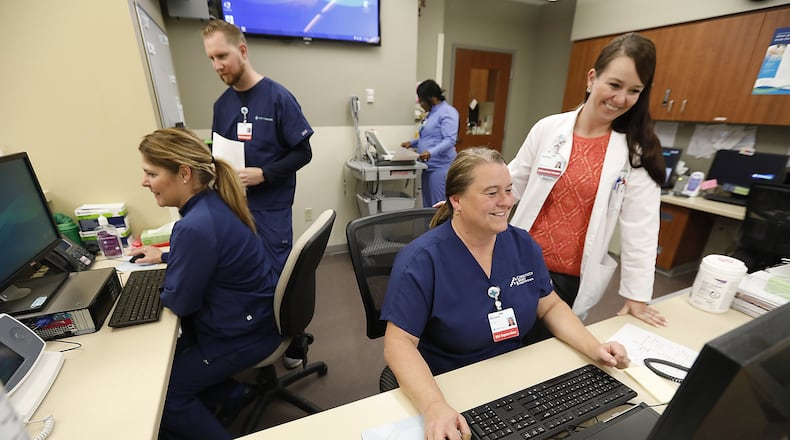 A group of nurses work at a nurses station in the Emergency Department of Springfield Regional Medical Center. Bill Lackey/Staff